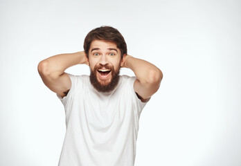 emotional man in a white t-shirt serious look Lifestyle