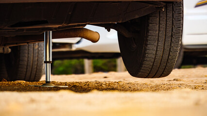 Caravan leveling support leg in use.