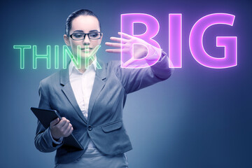 Think big concept with businesswoman