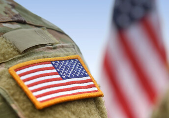 US soldiers. US army. USA patch flag on the US military uniform. Veterans Day. Memorial Day. - obrazy, fototapety, plakaty
