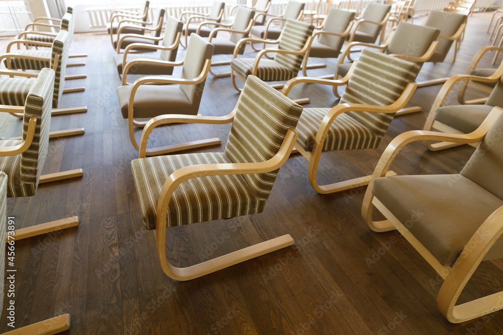 Poster chairs stand in rows in the hall