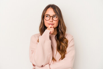 Young caucasian woman isolated on white background looking sideways with doubtful and skeptical expression.