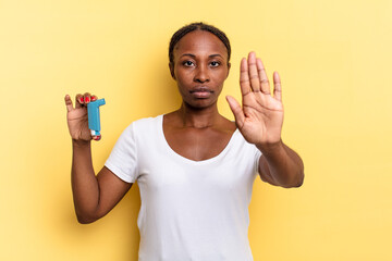 looking serious, stern, displeased and angry showing open palm making stop gesture. asthma concept