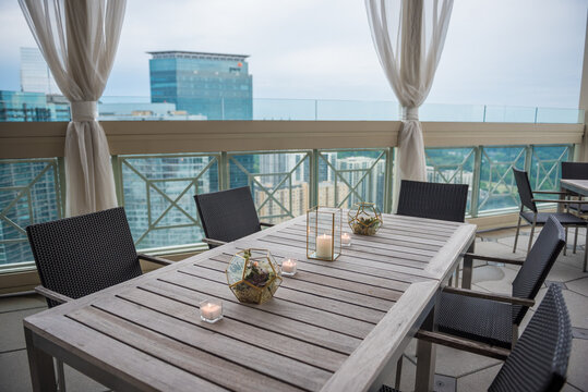 Closeup Of Wooden Tables And Chairs On A Balcony Of A Restaurant In Atlanta, The US