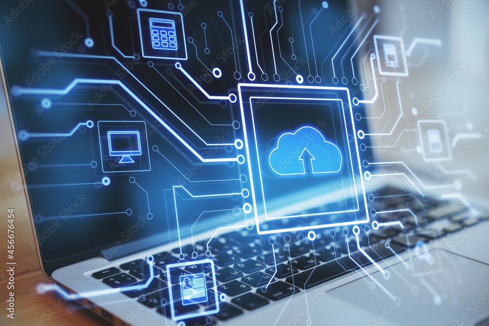 Poster Close up of laptop at desktop with abstract glowing circuit cloud computing interface on blurry blue bokeh background. Information, technology and network concept.