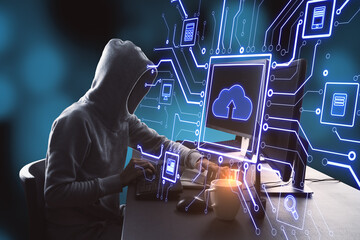 Hacker at desktop using computers with abstract glowing circuit cloud computing interface on blurry...