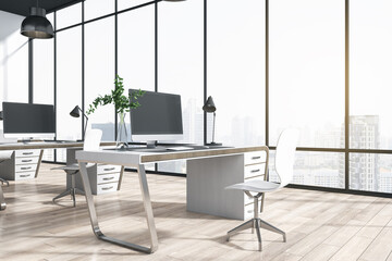 Minimalistic coworking office interior with window and bright city view, desks, computer, monitors, chairs and wooden flooring with shadows. 3D Rendering.