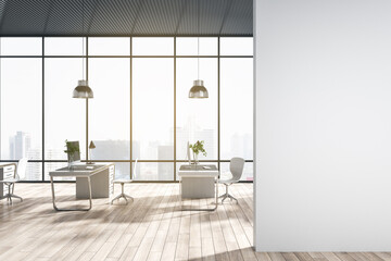 Modern coworking office interior with window and bright city view, desks, computer, monitors, chairs and wooden flooring with shadows. Empty mock up place on wall. 3D Rendering.