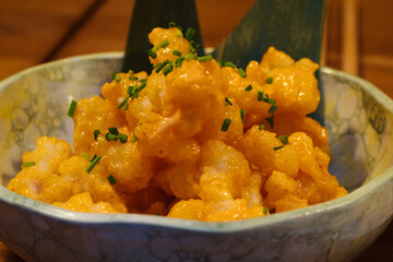 Popcorn shrimp is an appetizer made of tender shrimp that's coated in a seasoned breading, then fried until golden and crispy. 