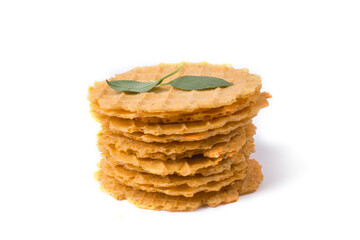 a stack of thin crispy salty waffles with lemon basil leaves
