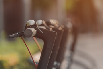 Electric scooters parked at city square for rent