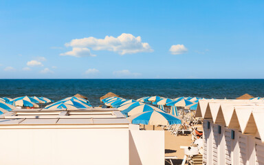 Adriatic sea, beach with bathers and umbrellas