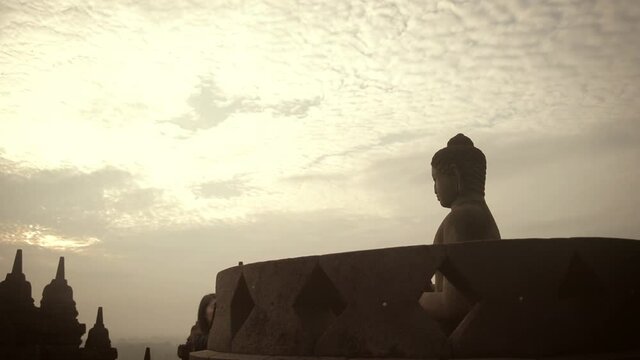 Sunrise Borobudur Buddha Statue in Yogyakarta Indonesia