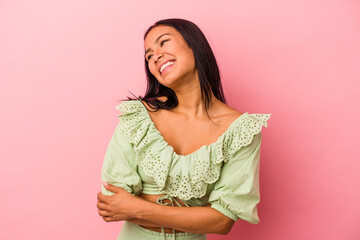 Young latin woman isolated on pink background  smiling confident with crossed arms.