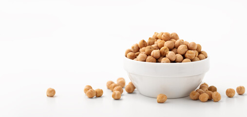 Chickpeas in white bowl on white background