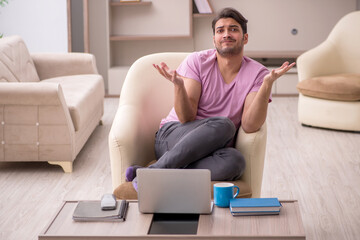 Young man working from home during pandemic