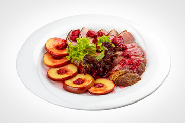 Duck breast mangre with berry confit and baked apple.  On a white background