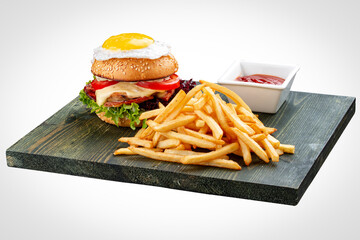 Burger for kids with fries and sauce. On a white background