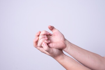 a man massages his hands from chilling pain