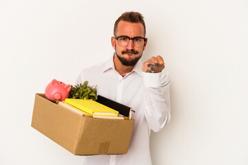 Young caucasian man with tattoos moving home isolated on white background  showing fist to camera, aggressive facial expression.