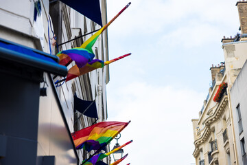 Beautiful shot of LGBTQ flags on a street building