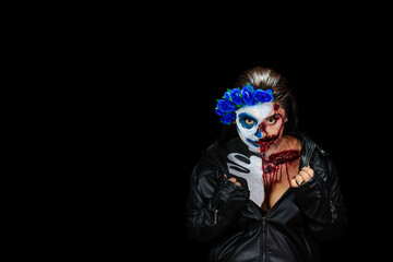 Halloween costume and makeup. Portrait of Calavera Catrina Zombie. Portrait of a woman with a...