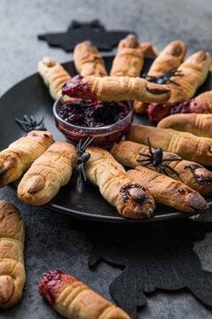 Bloody  cookies fingers for Halloween party celebration, Cookies "Witchs fingers". Dark background, food for Halloween