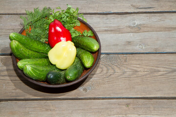 Autumn harvest of vegetables on an old wooden table and an old frying pan.