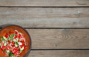 Autumn harvest of vegetables on an old wooden table and an old frying pan.