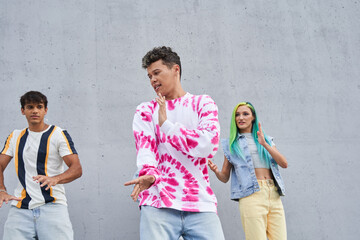 Group of different races girls and guys dancing