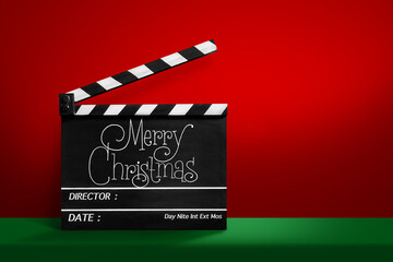 Merry Christmas, Handwriting on film slate. red and green background.