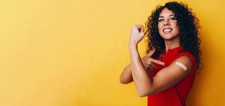 a black African American woman is vaccinated against covid and is very happy about it. the joy of having a vaccine made.