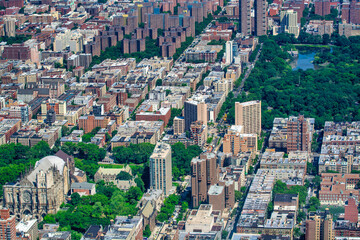 Central Park and Manhattan buildings on a sunny day, view from helicopter.