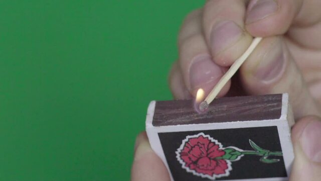 Close-up of a burning match