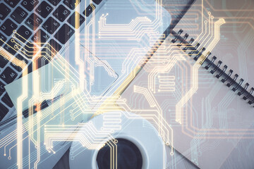 Technology hologram drawing over computer on the desktop background. Top view. Double exposure. Tech concept.
