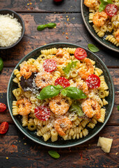 Prawn pasta salad with marinated green olives, cherry tomatoes and parmesan cheese.