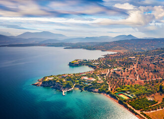 Obraz premium View from flying drone of Doroufi Kranidiou village. Attractive summer scene of Peloponnese peninsula, Greece, Europe. Incredible seascape of Myrtoan Sea. Traveling concept background.