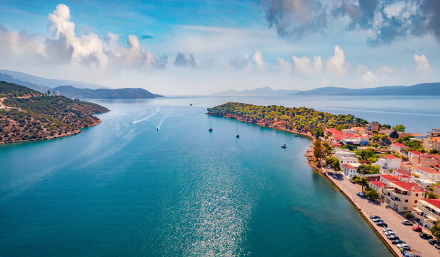 Spectacular summer cityscape of Ermioni port. Adorable morning seascape of Ionian sea. Aerial outdoor scene of Peloponnese peninsula, Greece, Europe. Active tourism concept background.