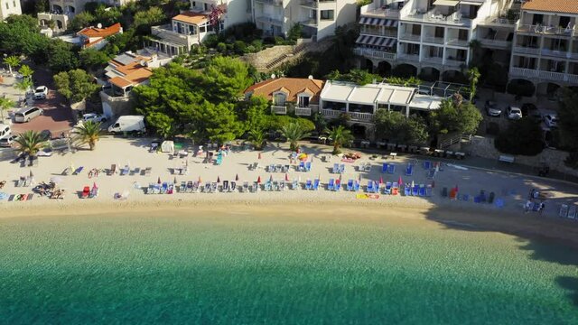 Aerial view of Brela town below Biokovo mountain, the Adriatic Sea, Croatia
