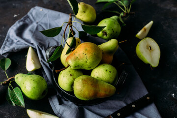 Ripe yellow pears on a dark background
