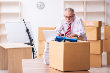 Old businessman employee in relocation concept