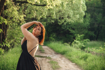 Redhead girl in greenery