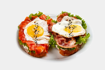 Toast with salmon, bacon and cream cheese.  On a wooden background. Breakfast