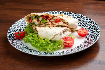 Fresh chicken roll with fresh tomatos, salad, cheese and onions. Shaurma, shawerma, fajita