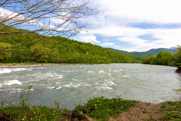 Mountain rivers, sources of clean water reserves on the planet, on a sunny spring day, a flood after the snow melts.