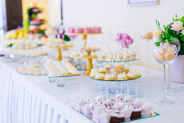Sweets, a table with sweets and desserts. Buffet with delicious muffins, cakes, cookies