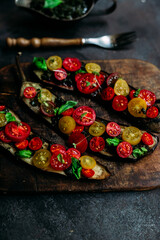 Fototapeta na wymiar Baked eggplant appetizer with tomatoes and cheese