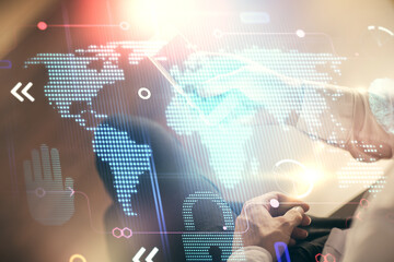 Multi exposure of man's hands holding and using a digital device and map drawing. International...