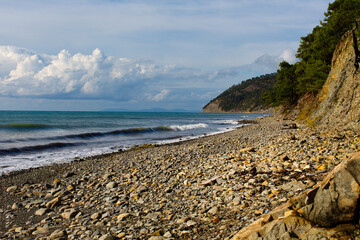 Fototapeta na wymiar An empty beach with rocks