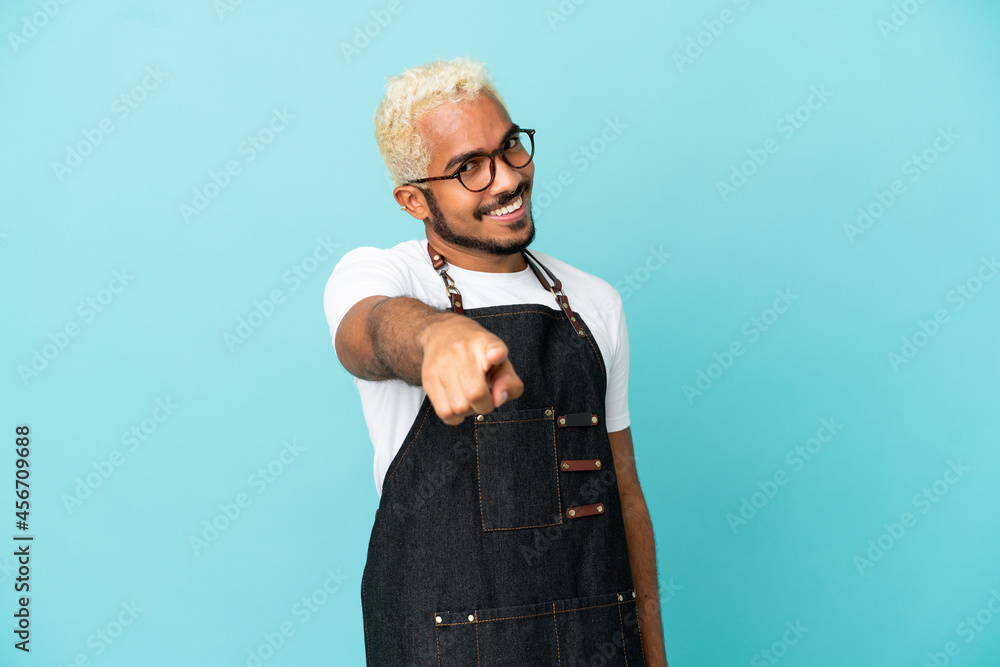 Canvas Prints restaurant colombian waiter man isolated on blue background points finger at you with a confident ex